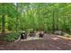 Inviting backyard with a fire pit and comfortable seating, great for outdoor gatherings and relaxation at 27 Woodgate Ct, Durham, NC 27713