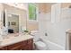 Bathroom featuring neutral walls, wood vanity and combo tub and shower at 27 Woodgate Ct, Durham, NC 27713