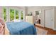 Bedroom featuring hardwood floors, bay window, and adjoining bathroom at 27 Woodgate Ct, Durham, NC 27713