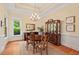 Elegant dining room with a chandelier, hardwood floors, and classic furnishings for formal dinners at 27 Woodgate Ct, Durham, NC 27713