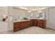 Spacious bathroom with dual vanities, ample counter space, and tile floors at 27 Woodgate Ct, Durham, NC 27713