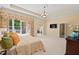 Spacious main bedroom suite with neutral tones, large windows, and an en suite at 27 Woodgate Ct, Durham, NC 27713
