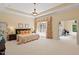 Bright main bedroom with elegant décor, ample space, and natural light at 27 Woodgate Ct, Durham, NC 27713