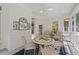 Charming screened porch with cozy seating, plants, and natural light, creating a perfect retreat at 27 Woodgate Ct, Durham, NC 27713