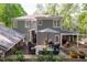 Private backyard with a patio area, outdoor seating, and mature landscaping at 2704 Fairview Rd, Raleigh, NC 27608