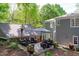 Backyard patio with stone pavers, outdoor seating, and lush landscaping at 2704 Fairview Rd, Raleigh, NC 27608