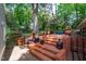 Outdoor patio and grilling area with brick stairs and landscaping at 2704 Fairview Rd, Raleigh, NC 27608