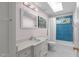 Updated bathroom with a modern vanity, a skylight, and a tiled shower at 2704 Fairview Rd, Raleigh, NC 27608