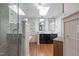Bright bathroom featuring a glass shower, double vanity, and a skylight, offering a luxurious feel at 2704 Fairview Rd, Raleigh, NC 27608