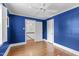 Comfortable bedroom with hardwood floors, ample natural light, and an entrance to a second floor landing at 2704 Fairview Rd, Raleigh, NC 27608