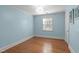 Light and airy bedroom with hardwood floors and a neutral color scheme, creating a relaxing atmosphere at 2704 Fairview Rd, Raleigh, NC 27608