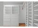 Spacious walk-in closet with built-in shelving and drawers, providing ample storage space at 2704 Fairview Rd, Raleigh, NC 27608