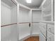 Well-organized walk-in closet featuring rods and drawers, offering lots of storage at 2704 Fairview Rd, Raleigh, NC 27608