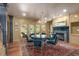 Bright dining room with a fireplace, built in shelving, French doors, and hardwood floors at 2704 Fairview Rd, Raleigh, NC 27608