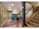 Dining room featuring a fireplace, dining table, and stairs leading to other floors at 2704 Fairview Rd, Raleigh, NC 27608
