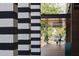 Exterior view of Great Outdoor Provision Co. with distinctive black and white striped columns at 2704 Fairview Rd, Raleigh, NC 27608