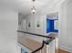 Bright hallway with hardwood floors, chandelier, and artwork, creating an inviting space at 2704 Fairview Rd, Raleigh, NC 27608