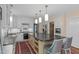 Spacious kitchen features white cabinets, a large island, and stainless steel appliances at 2704 Fairview Rd, Raleigh, NC 27608