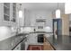 Functional kitchen with white cabinetry, stainless steel appliances, and a center island at 2704 Fairview Rd, Raleigh, NC 27608