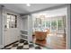 Inviting living room with large windows, hardwood floors, comfortable seating, and stylish decor at 2704 Fairview Rd, Raleigh, NC 27608