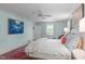 Comfortable main bedroom with a ceiling fan, windows and a decorative rug with bed at 2704 Fairview Rd, Raleigh, NC 27608