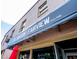 Close up of The Barton & Fairview restaurant awning with store front entrance in view at 2704 Fairview Rd, Raleigh, NC 27608