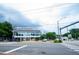A modern two-story building featuring floor-to-ceiling windows displaying a commercial shop at 2704 Fairview Rd, Raleigh, NC 27608
