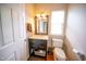 Modern powder room with a stylish vanity, mirror, and neutral decor at 2711 Laurelcherry St, Raleigh, NC 27612