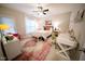 Bright bedroom featuring a decorative area rug, a workspace and ample natural light at 2711 Laurelcherry St, Raleigh, NC 27612