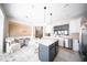 Cozy kitchen nook with a marble countertop, a table for two, and stainless steel appliances at 2711 Laurelcherry St, Raleigh, NC 27612