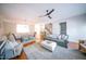 Bright and airy living room with hardwood floors, a plush rug, and open layout at 2711 Laurelcherry St, Raleigh, NC 27612