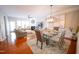 Open-concept living room with hardwood floors, fireplace, and plenty of natural light at 2711 Laurelcherry St, Raleigh, NC 27612