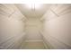Spacious walk-in closet with ample shelving and storage options to maximize organization at 2711 Laurelcherry St, Raleigh, NC 27612