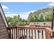 Balcony view showcasing the surrounding trees and other buildings at 294 Summerwalk Cir, Chapel Hill, NC 27517