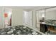 A bedroom with carpet and view into the bathroom and mirrored closet doors at 294 Summerwalk Cir, Chapel Hill, NC 27517