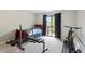 Comfortable bedroom featuring a sliding glass door and balcony access; also includes exercise equipment at 294 Summerwalk Cir, Chapel Hill, NC 27517