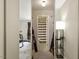 A hallway reflected in a mirrored closet leads to a bathroom with a striped shower curtain at 294 Summerwalk Cir, Chapel Hill, NC 27517