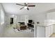 Open living area includes a fireplace and view into kitchen at 294 Summerwalk Cir, Chapel Hill, NC 27517