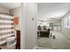 An open floorplan offers carpeted living spaces that connect the bathroom, kitchen, and living room at 294 Summerwalk Cir, Chapel Hill, NC 27517
