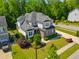 Beautiful aerial view of the home with lush landscaping and a well-maintained yard at 3029 Mountain Hill Dr, Wake Forest, NC 27587