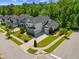 An aerial view showcasing the property's manicured lawn, landscaping, and neighborhood setting at 3029 Mountain Hill Dr, Wake Forest, NC 27587