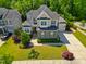 Aerial shot of a meticulously landscaped home, highlighting its architectural details and curb appeal at 3029 Mountain Hill Dr, Wake Forest, NC 27587