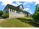 Spacious backyard featuring a lush lawn, mature trees, and views of the home's exterior at 3029 Mountain Hill Dr, Wake Forest, NC 27587