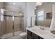 Neutral-toned bathroom with a shower and glass door and a large vanity sink at 3029 Mountain Hill Dr, Wake Forest, NC 27587