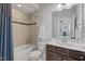 Well-lit bathroom featuring a bathtub, shower, toilet, and a vanity with a dark wood cabinet at 3029 Mountain Hill Dr, Wake Forest, NC 27587