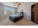 Comfortable bedroom with a queen bed, a ceiling fan, and a window with natural light and a closet at 3029 Mountain Hill Dr, Wake Forest, NC 27587