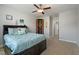 Inviting bedroom featuring a queen bed, a ceiling fan, and a closet with a wooden door at 3029 Mountain Hill Dr, Wake Forest, NC 27587