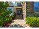 Charming front entrance with stone accents, a covered porch, and landscaped front yard with stone steps at 3029 Mountain Hill Dr, Wake Forest, NC 27587