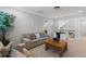 Comfortable living room with a beige sofa, throw pillows, and a wooden coffee table with decor at 3029 Mountain Hill Dr, Wake Forest, NC 27587