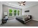 Spacious primary bedroom with large windows and a tray ceiling at 3029 Mountain Hill Dr, Wake Forest, NC 27587